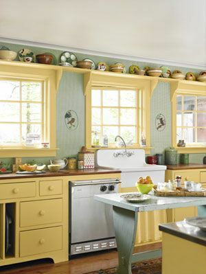 kuchyně se zelenými stěnami a žluté skříňky